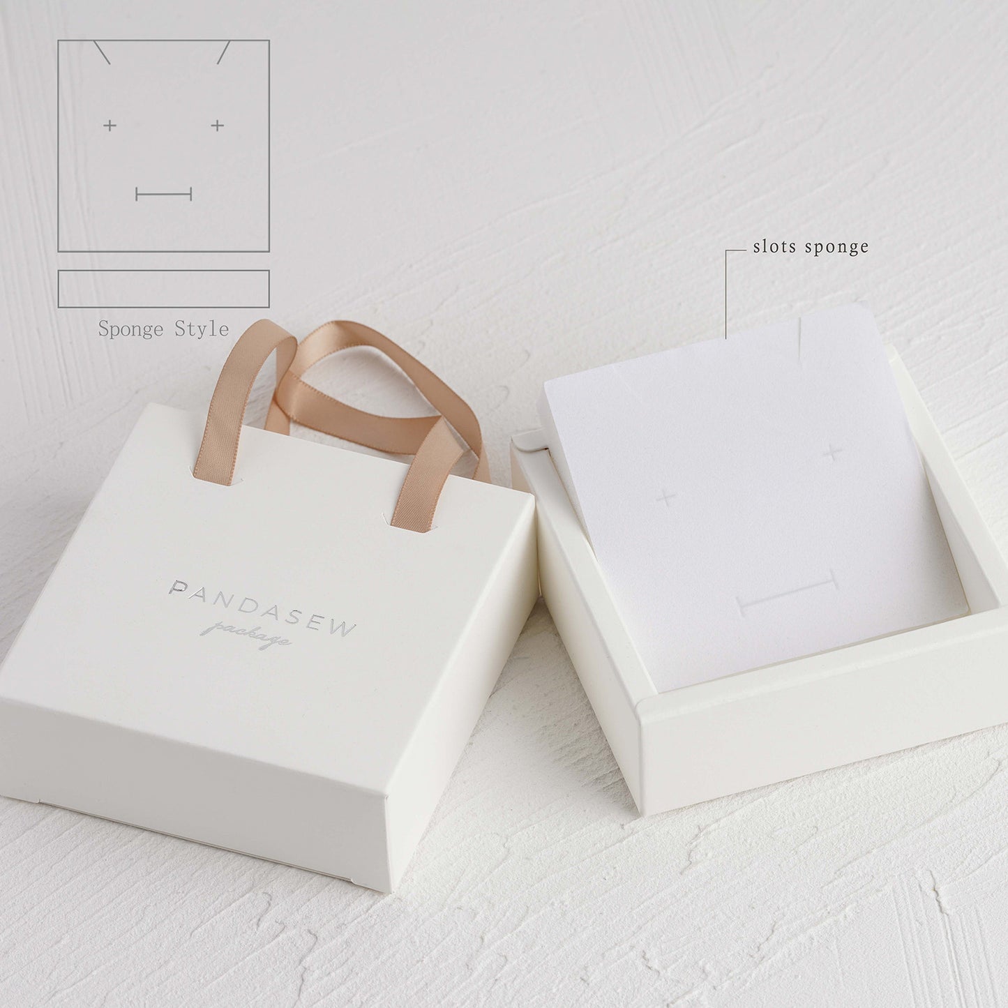 White paper box with champagne ribbon