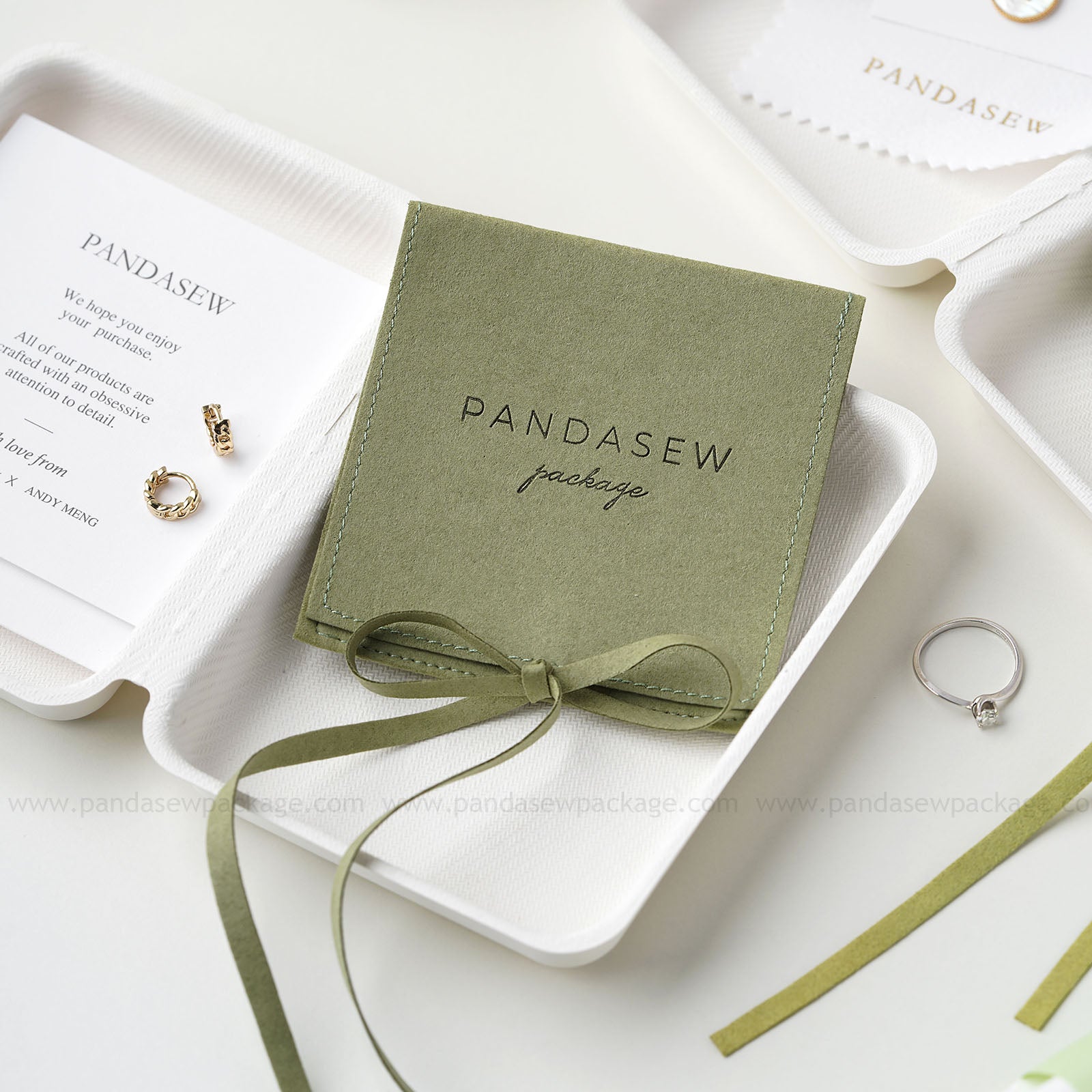 Biodegradable Jewelry Box holds a green microfiber pouch