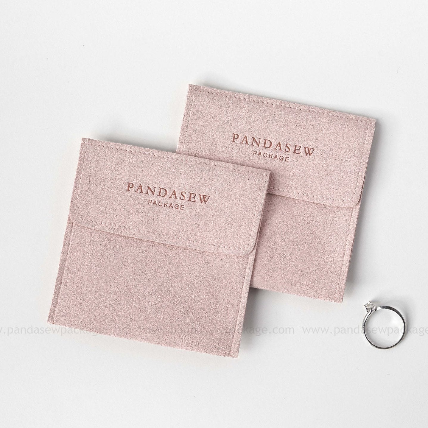 Pink microfiber small bag with a Pandasew debossed logo on top