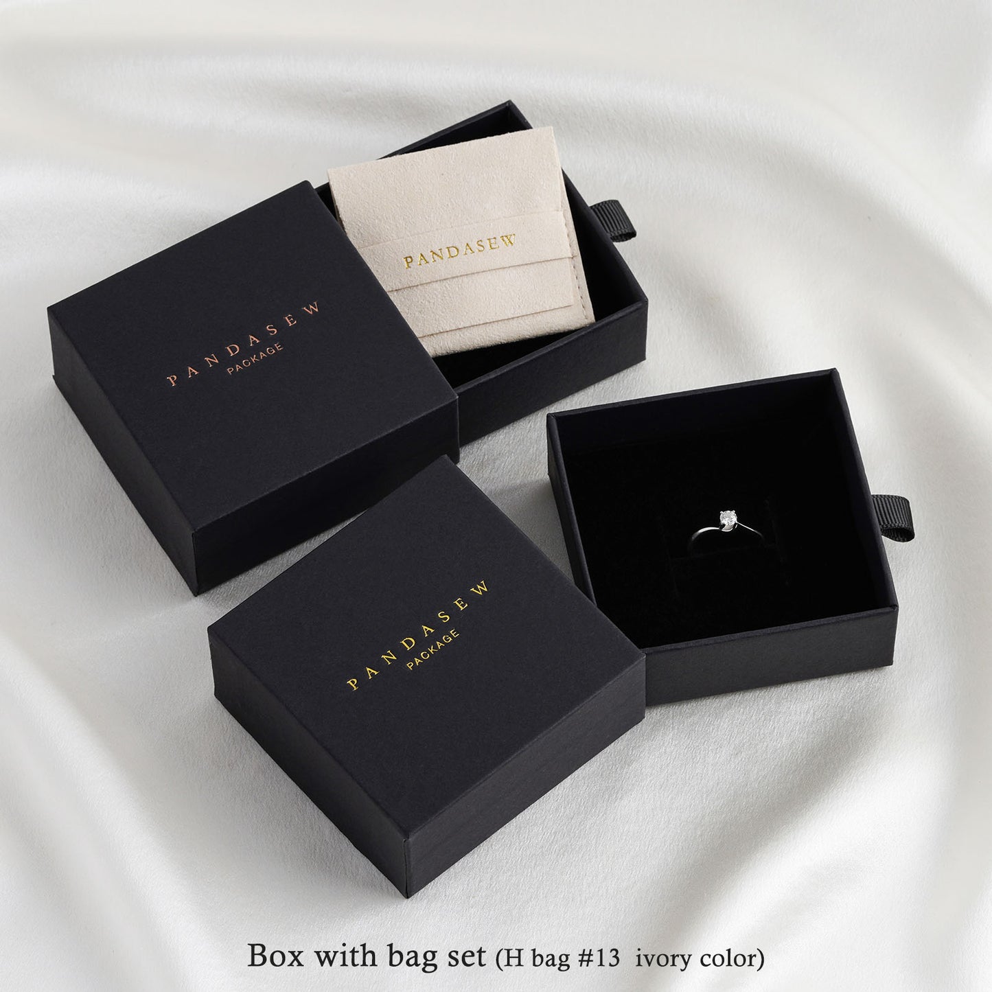 Black jewelry gift boxes, ivory jewelry bag inside